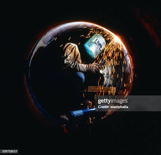 welder in pipe - welding stock pictures, royalty-free photos & images