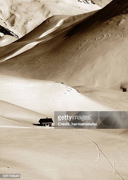 lone house in snow covered alps - be boundless summit stock pictures, royalty-free photos & images