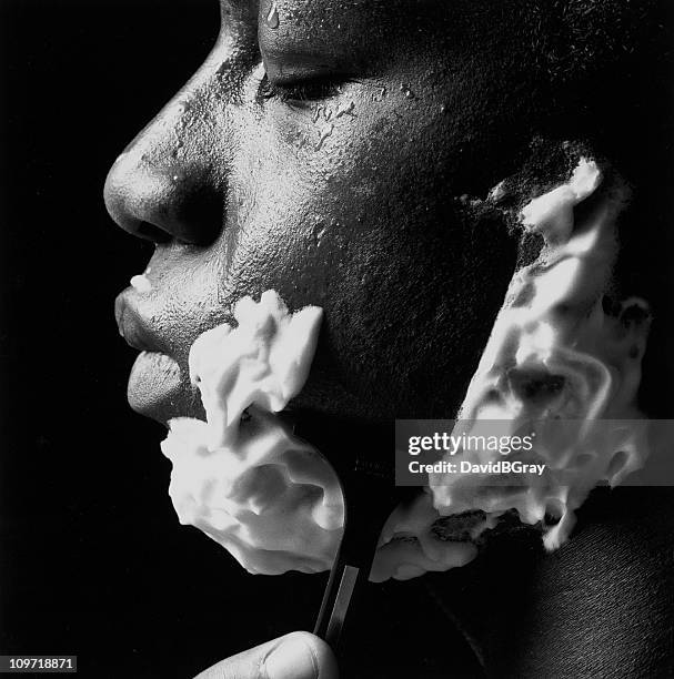 study in black and white : african american man shaving - man shaving face stock pictures, royalty-free photos & images