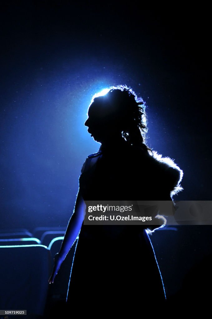Silhouette of Woman on Blue Background