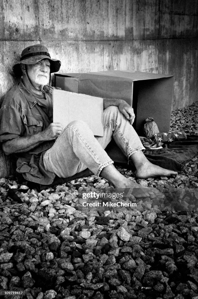 Down and Out Vietnam Vet Holding a Blank Sign