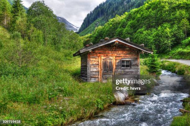 hdr of barn in alpine river landscape (austria) - hohe tauern national park stockfoto's en -beelden