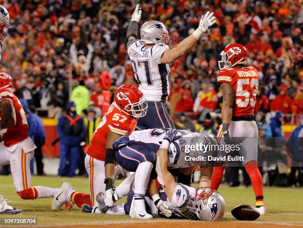 Rex Burkhead of the New England Patriots celebrates with James Develin after scoring the game-winning touchdown to defeat the Kansas City Chiefs in...