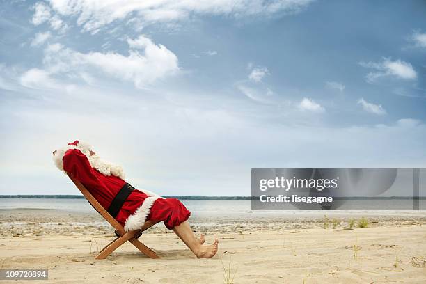 vacations for santa - christmas funny stockfoto's en -beelden