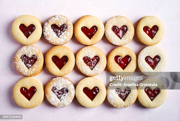 traditional linzer cookie with strawberry jam - homemade valentine stock pictures, royalty-free photos & images