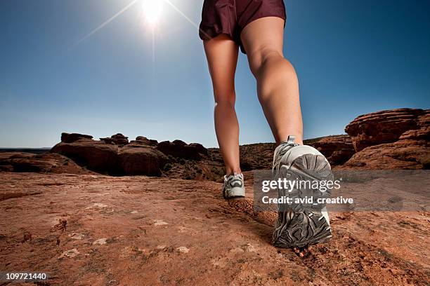 woman walking in desert - beenden stockfoto's en -beelden