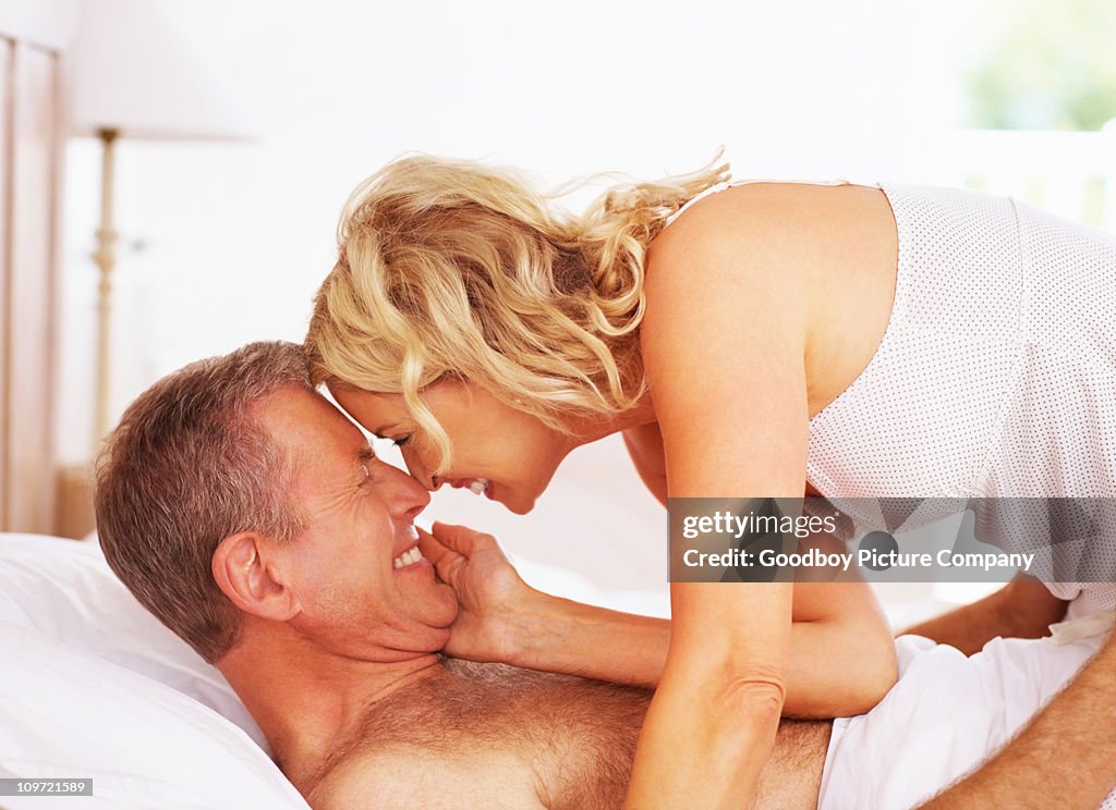 Romantic mature couple in bed