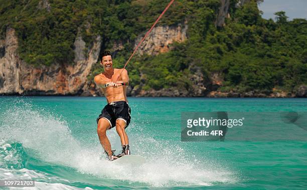 wakeboarding on tropical waters (xxxl) - waterskiing stock pictures, royalty-free photos & images