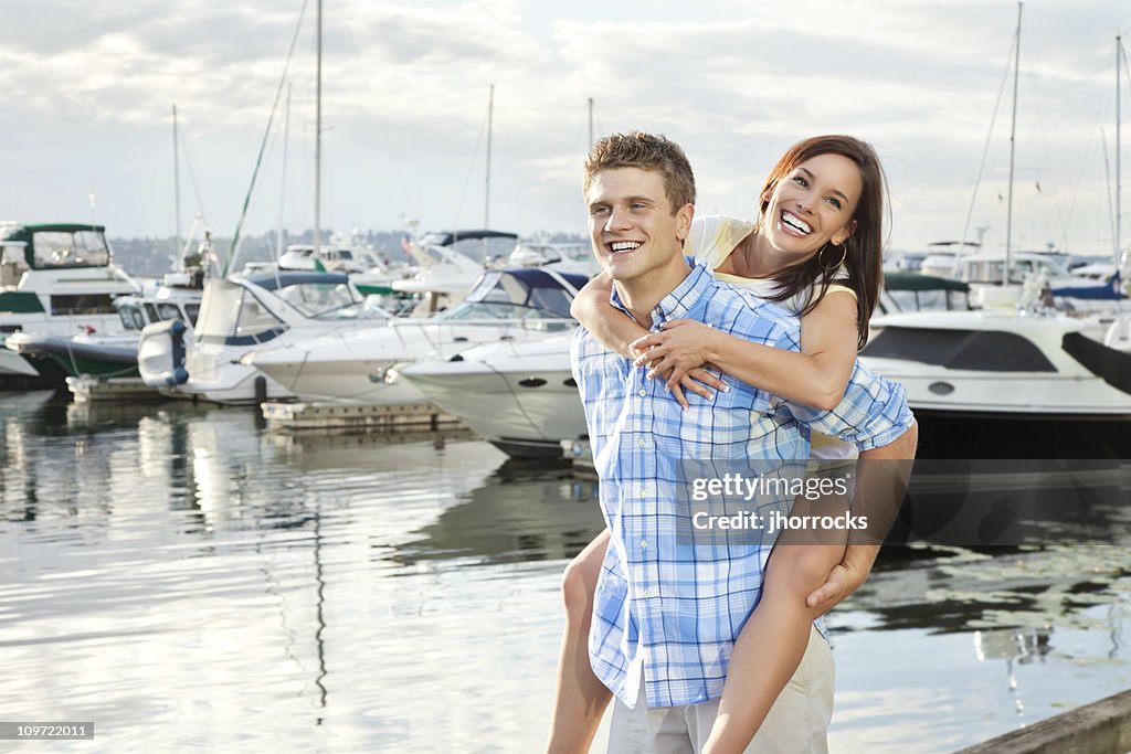 Young Couple Havin Fun at Boat Dock