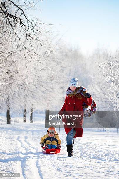 family having fun in winter - kids playing snow stock pictures, royalty-free photos & images