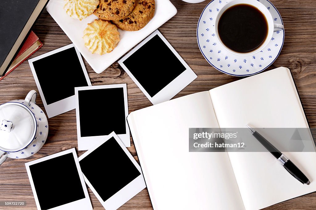 Photo album with coffee and biscuits