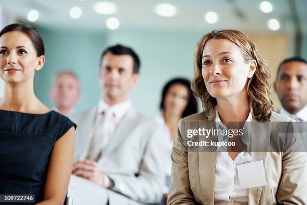 business team at a seminar - press conferences stock pictures, royalty-free photos & images