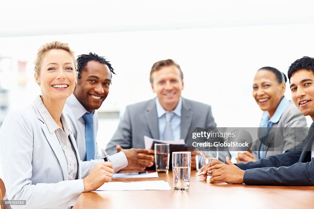 Happy business colleages at a meeting