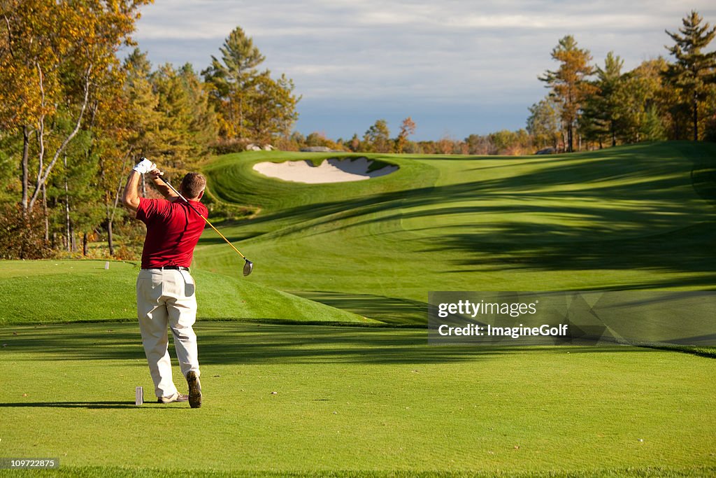 Senior Male Caucasian Golfer Driving off the Tee in Fall