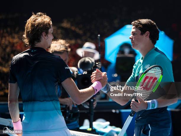 Milos Raonic of Canada shakes hands with Alexander Zverev of Germany after beating him on day eight of the 2019 Australian Open at Melbourne Park on...