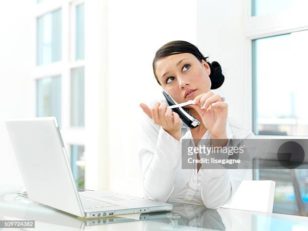 woman files her nails at work - nail file stock pictures, royalty-free photos & images