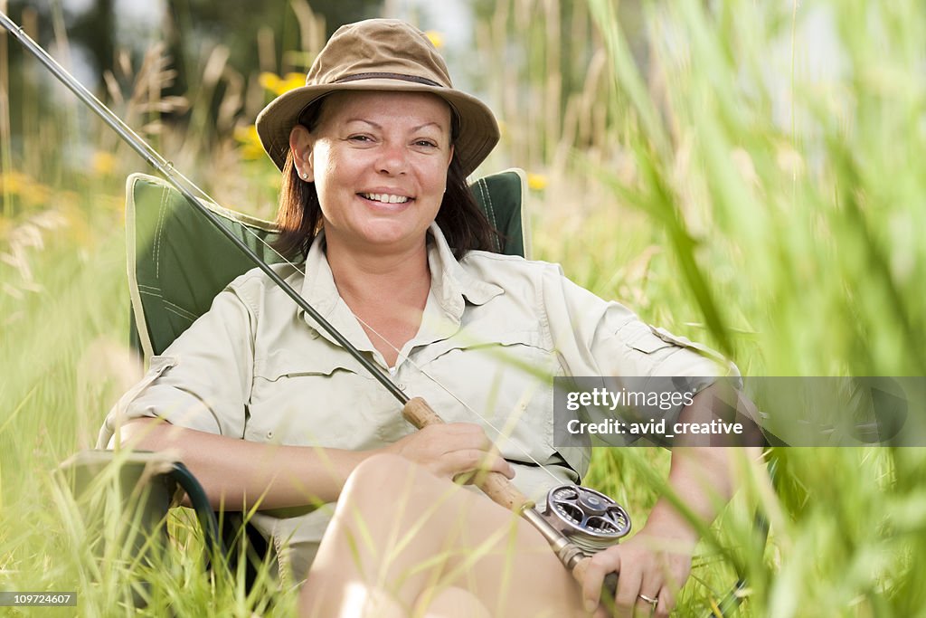 Happy Fishing Woman Relaxing In Chair