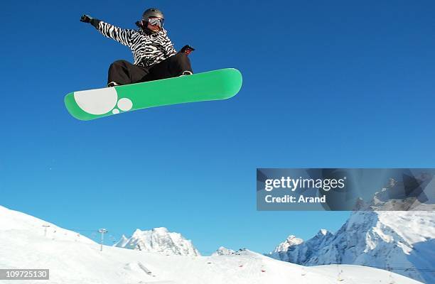 snowboarder woman - snowboard jump bildbanksfoton och bilder