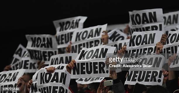Bayern Muenchen fans hold up a placards reading 'No Neuer' before the DFB Cup semi final match between FC Bayern Muenchen and Schalke 04 at Allianz...