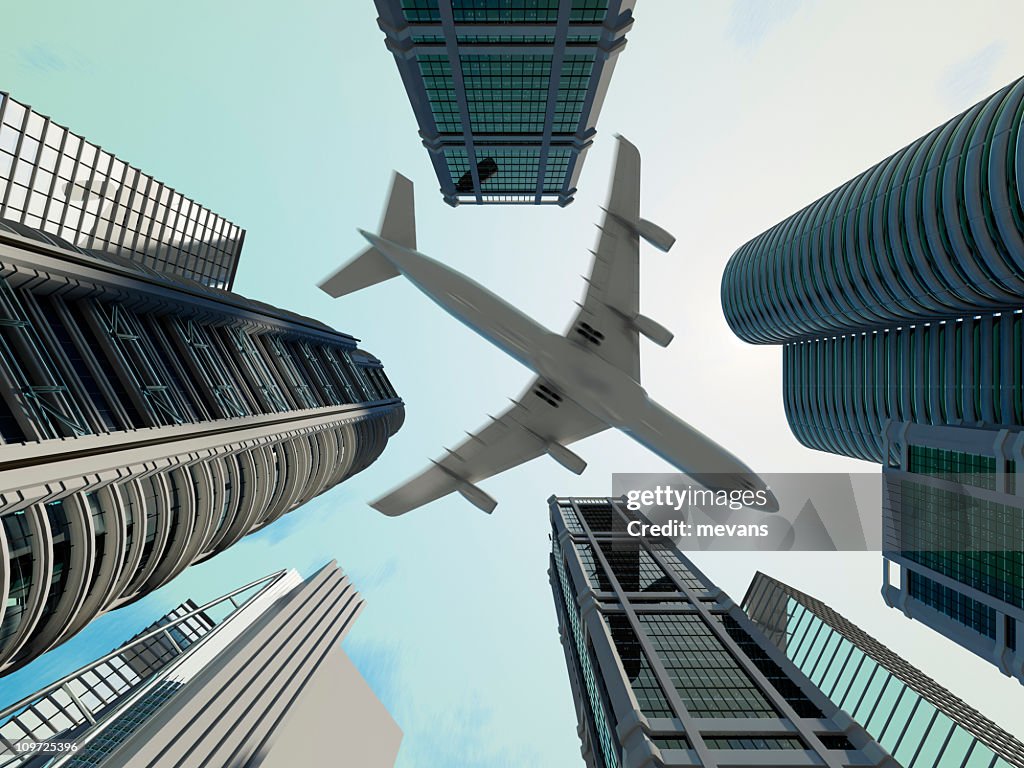 Ground view of jet flying over skyscrapers in the city