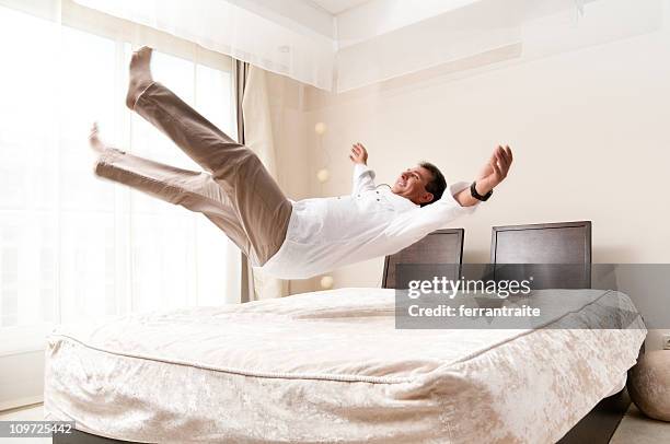 bed jump - person falling mid air stock pictures, royalty-free photos & images