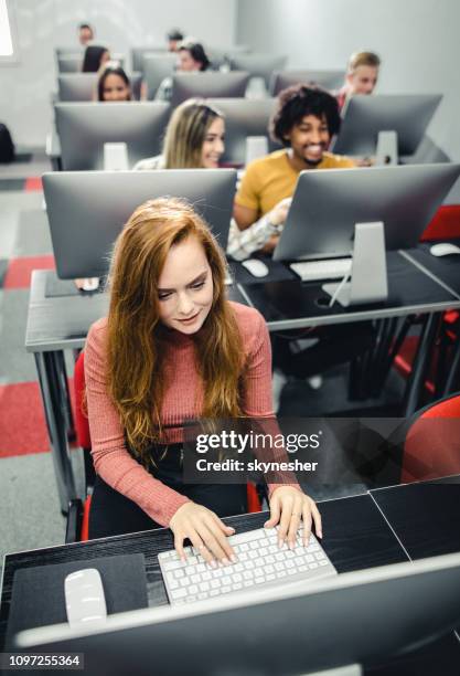 above view of a female student e-learning on desktop pc. - college students computer lab stock pictures, royalty-free photos & images