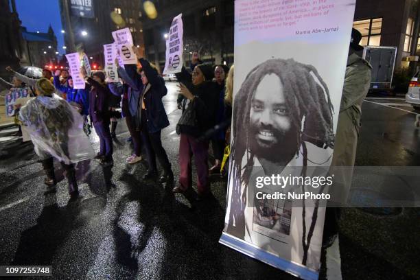 Group of two dozen activist briefly block traffic during a rally outside the District Attorney Office, in Center City Philadelphia, PA, on December...