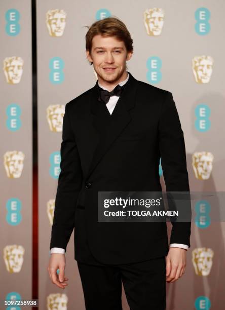British actor Joe Alwyn poses on the red carpet upon arrival at the BAFTA British Academy Film Awards at the Royal Albert Hall in London on February...