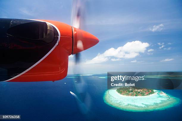 aerial view of maldive islands - seaplane stock pictures, royalty-free photos & images