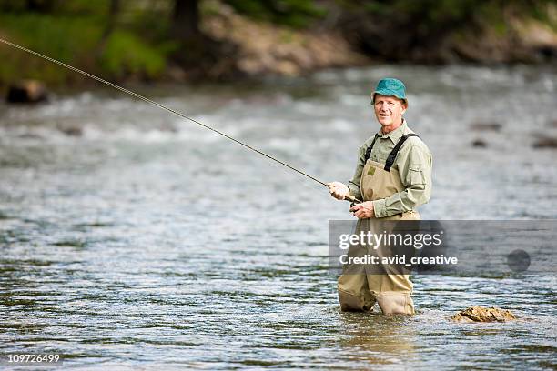 mature man fly fishing in mountain stream - wading boots stock pictures, royalty-free photos & images