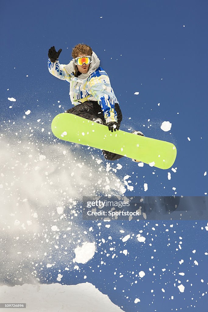 Snowboarder Suspended High In Air