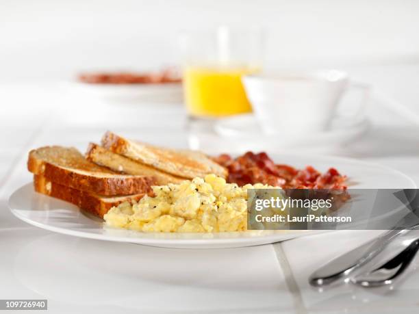 scrambled eggs with bacon and toast - toasted bread stock pictures, royalty-free photos & images