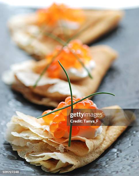 blini with red caviar - red caviar stock pictures, royalty-free photos & images