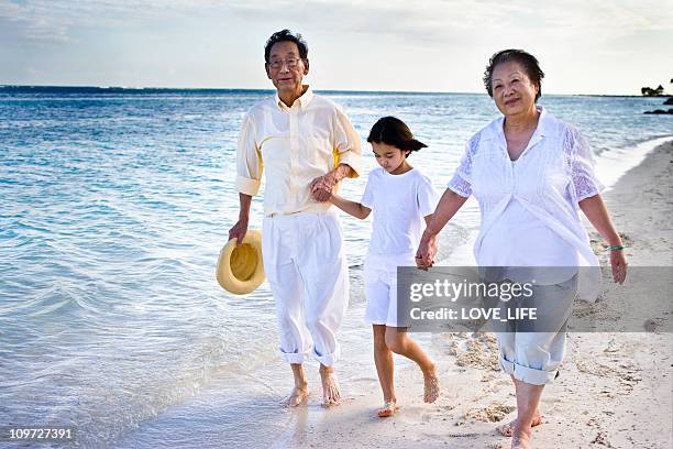 retired couple and grand daughter - punta cana stock pictures, royalty-free photos & images