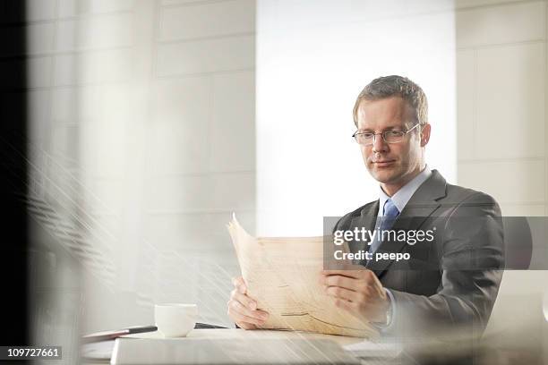 business man - financial newspaper stock pictures, royalty-free photos & images