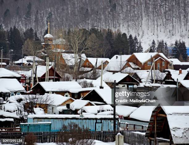 snowy village  in sibria russia - russia winter stock pictures, royalty-free photos & images