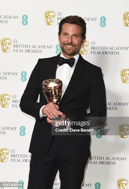 Winner of the Original Music award, Bradley Cooper poses in the press room at the EE British Academy Film Awards at Royal Albert Hall on February 10,...