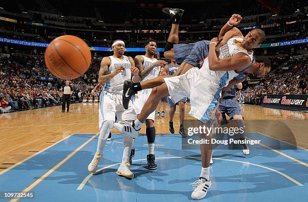 Arron Afflalo of the Denver Nuggets is fouled by Gerald Henderson of the Charlotte Bobcats as he tries to layup a shot at the Pepsi Center on March...