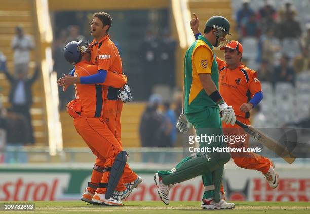 Wesley Barresi of the Netherlands congratulates Bernard Loots, after he bowled Graeme Smith of South Africa during the 2011 ICC World Cup Group B...