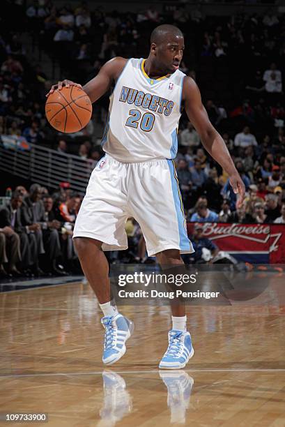 Raymond Felton of the Denver Nuggets dribbles the ball as he runs the offense against the Charlotte Bobcats at the Pepsi Center on March 2, 2011 in...