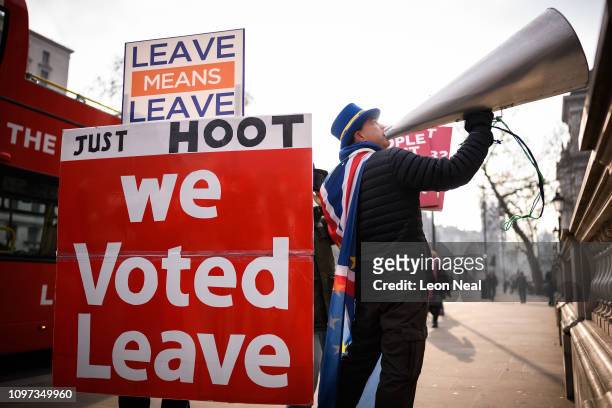 Anti-Brexit protestor Steve Bray stands with a pro-Brexit protestor as a cross-party group of MPs arrive at the Cabinet Office ahead of a Brexit...