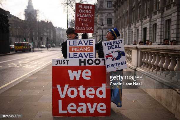 Anti-Brexit protestor Steve Bray stands with a pro-Brexit protestor as a cross-party group of MPs arrive at the Cabinet Office ahead of a Brexit...