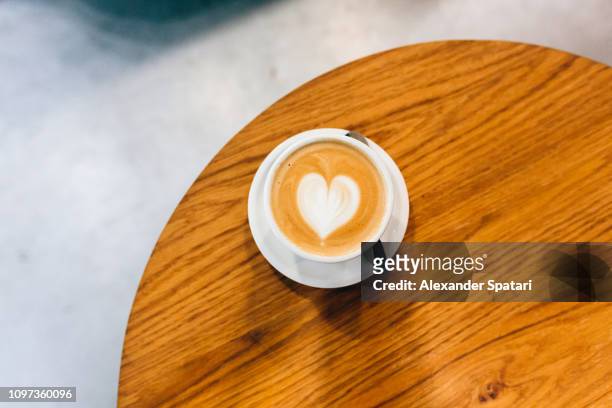 cappuccino with heart-shaped latte art - coffee heart fotografías e imágenes de stock