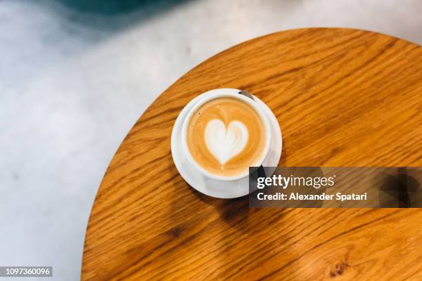 cappuccino with heart-shaped latte art - coffee heart stock pictures, royalty-free photos & images