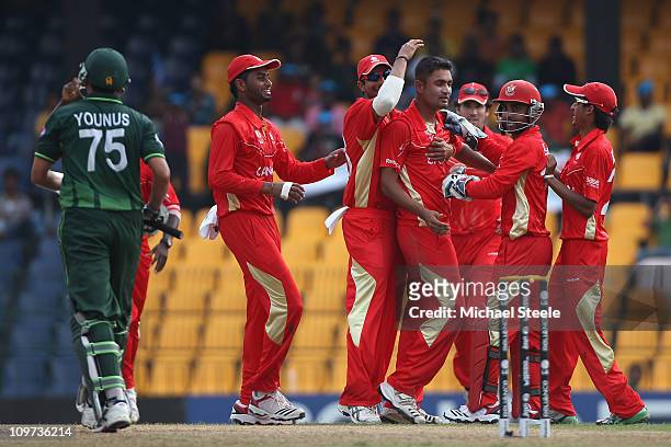 Harvir Baidwan of Canada celebrates taking the wicket of Younus Khan during the Canada v Pakistan 2011 ICC World Cup Group A match at the R....