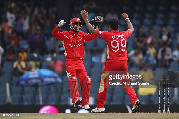 Rizwan Cheema of Canada celebrates taking the wicket of Kamran Akmal with Ashish Bagai during the Canada v Pakistan 2011 ICC World Cup Group A match...