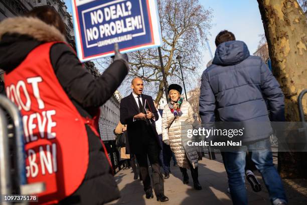 Labour MP Chuka Umunna and Conservative MP Anna Soubry pass a pro-Brexit protester after leaving the the Cabinet Office following a Brexit meeting...