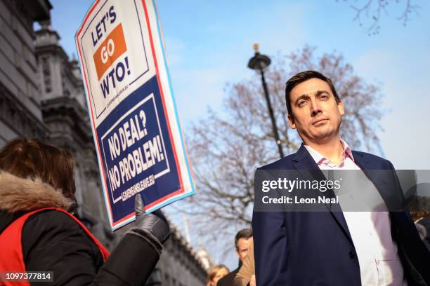 Labour MP Gavin Shuker passes a pro-Brexit protester after leaving the Cabinet Office following a Brexit meeting with Theresa May's Chief of Staff...