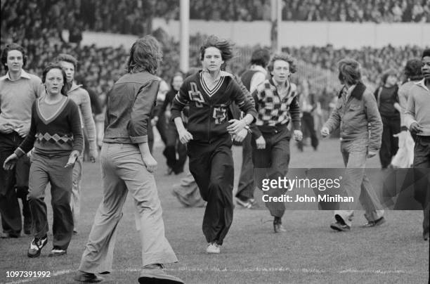 Fans invade Tottenham Hotspur FC pitch at White Hart Lane stadium, London, UK, 21st April 1975.
