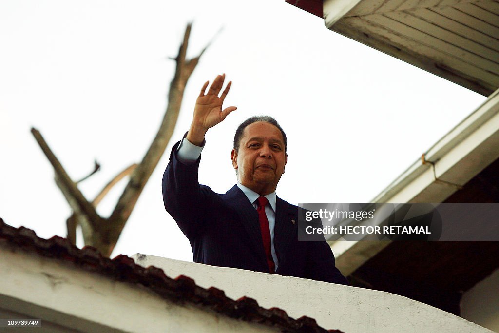 Jean-Claude Duvalier greets supporters a